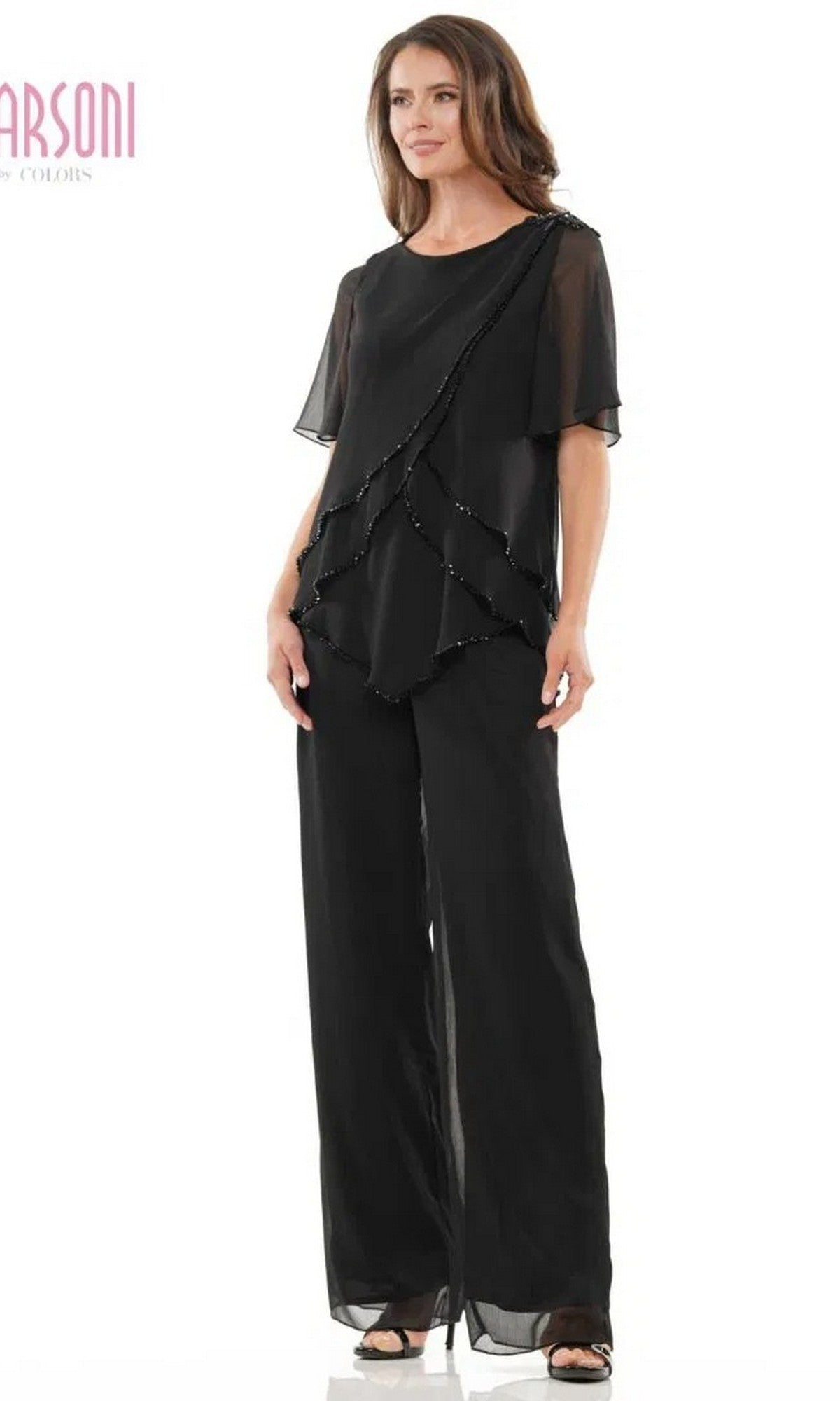 A woman models the Marsoni M321 long formal pantsuit in black, featuring a layered short-sleeved top and wide-leg chiffon pants, set against a plain white background.